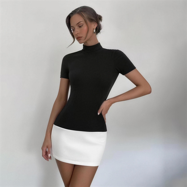 Black mock neck and white mini colourblock dress, front view