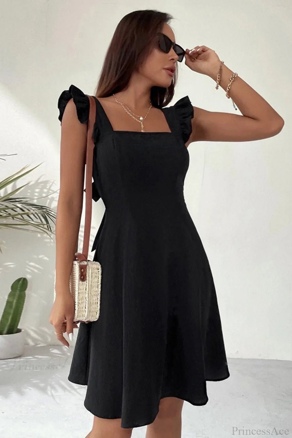 Nora Sleeveless Mini Dress with Ruffle Tie-back